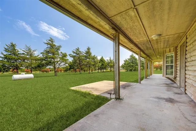 a view of a road with a big yard