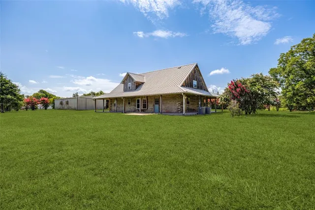 a front view of house with garden