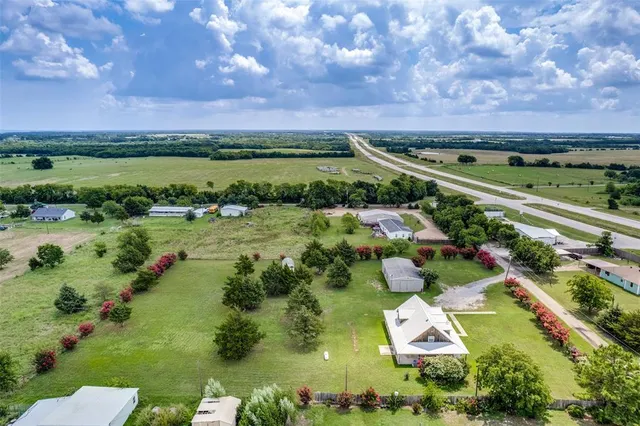 a view of lake with houses in the background