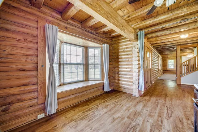 a view of a porch with wooden floor and stairs
