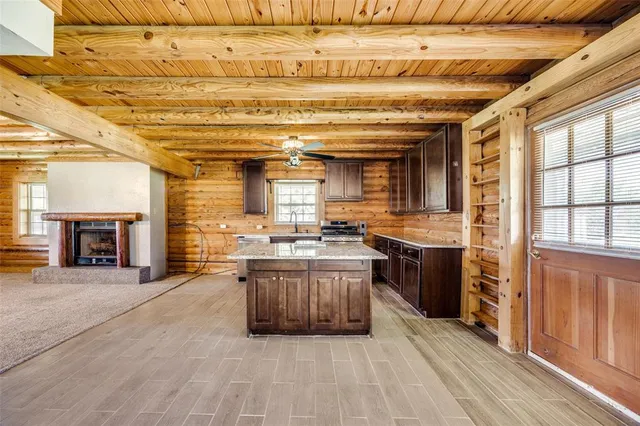 a kitchen with stainless steel appliances granite countertop a stove and cabinets