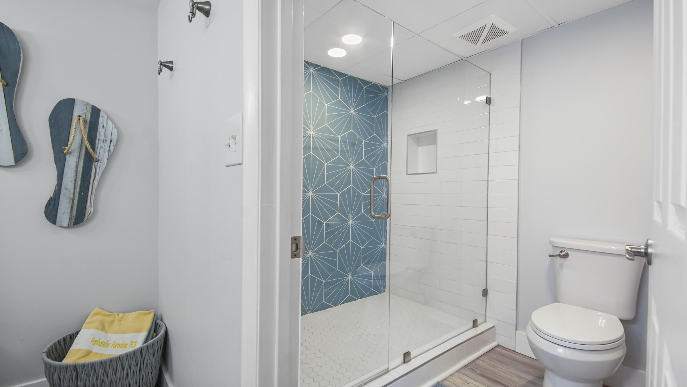10509 Front Beach Road, Unit 100 Panama City Beach, FL 32408 - Photo 36 of 52 a bathroom with a shower a toilet and a window