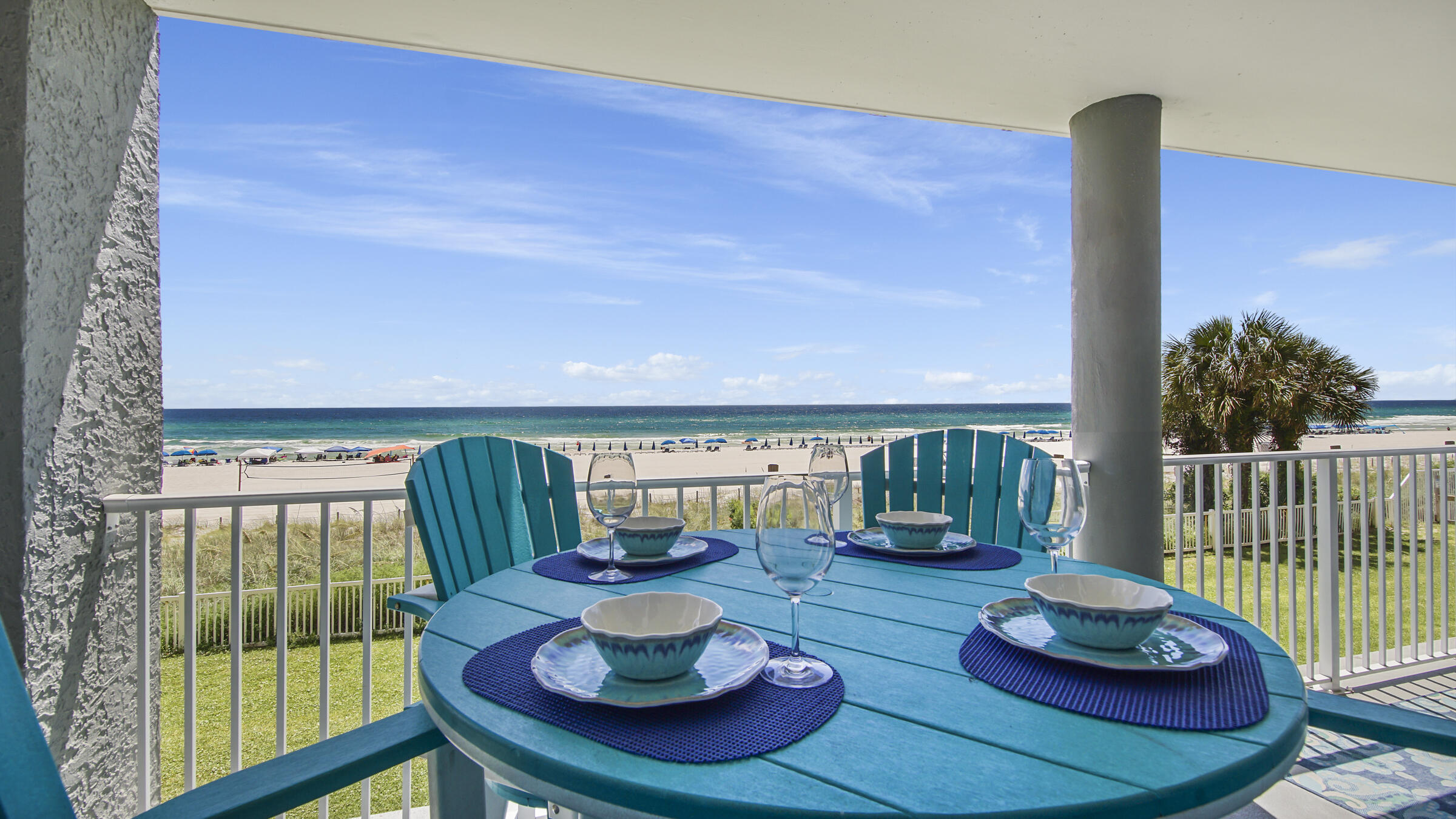 10509 Front Beach Road, Unit 100 Panama City Beach, FL 32408 - Photo 40 of 52 a living room with furniture and a floor to ceiling window