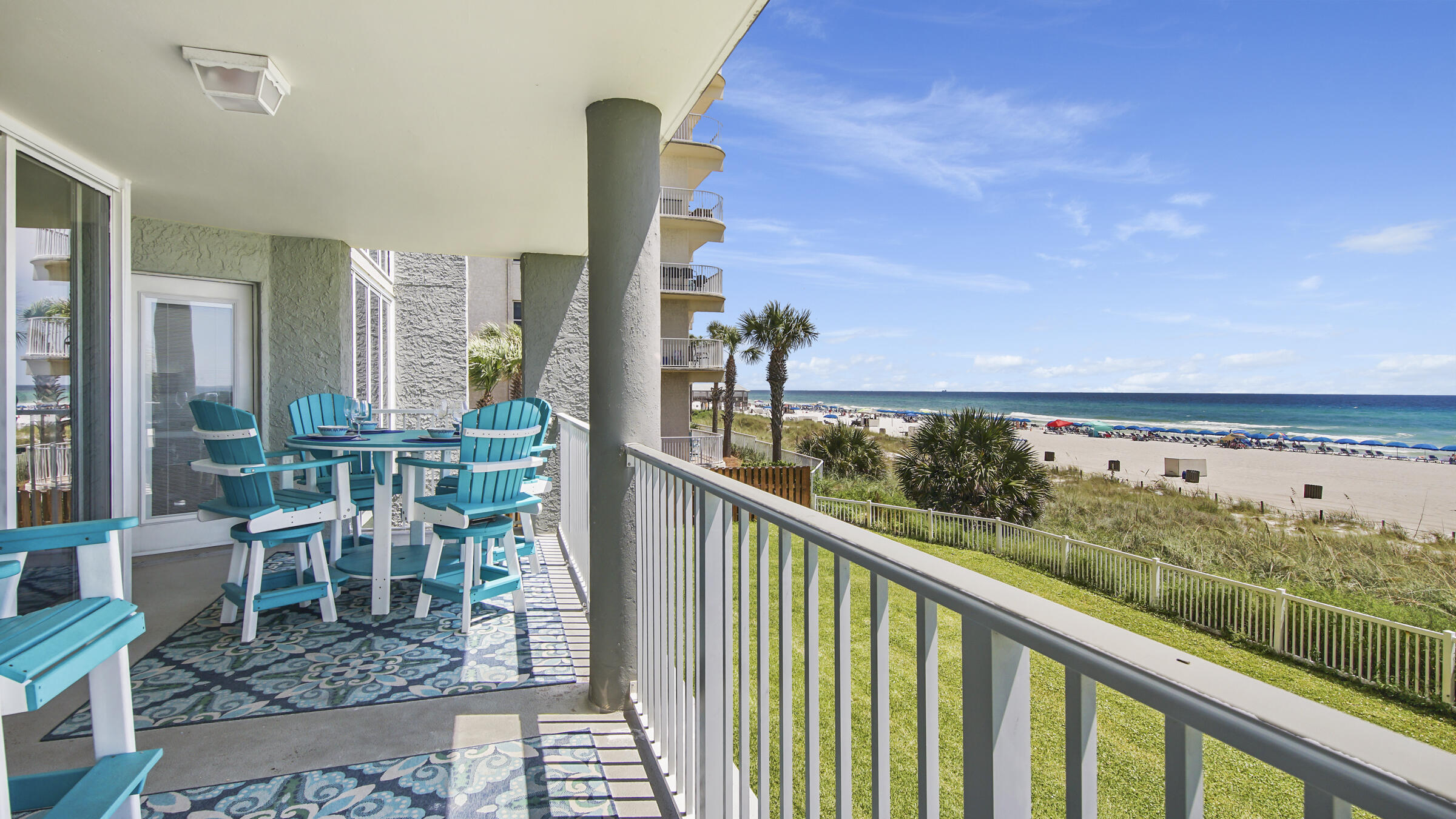 10509 Front Beach Road, Unit 100 Panama City Beach, FL 32408 - Photo 46 of 52 a city view from a balcony with outdoor seating