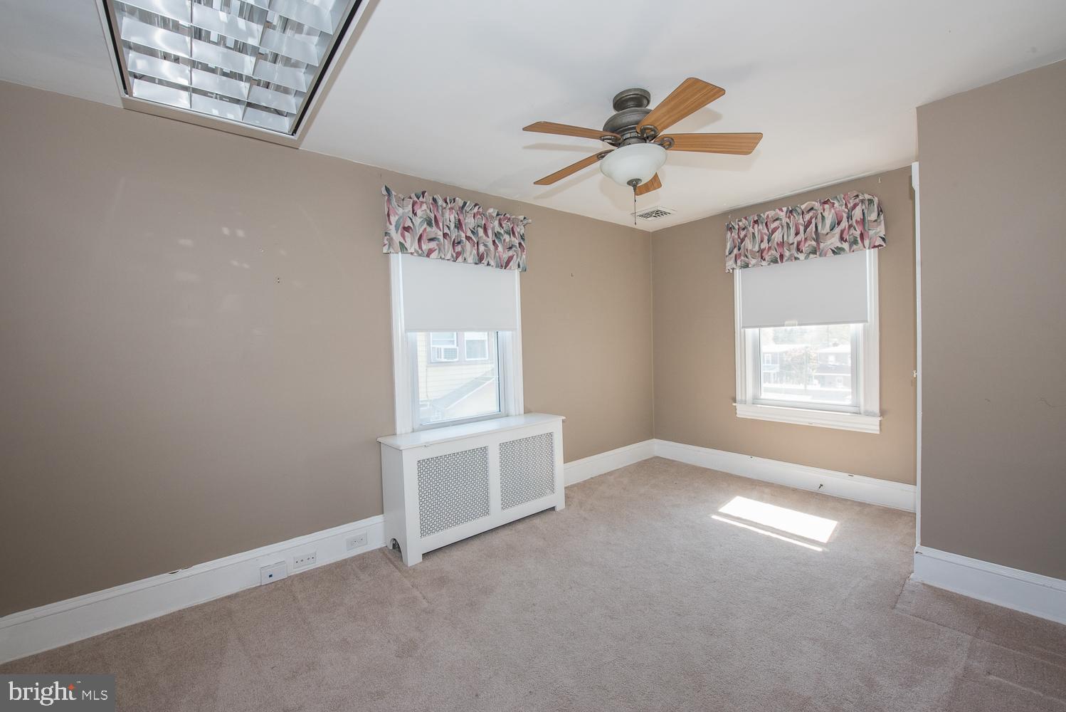 420 Darby Road Havertown, PA 19083 - Photo 15 of 21 an empty room with windows and fan