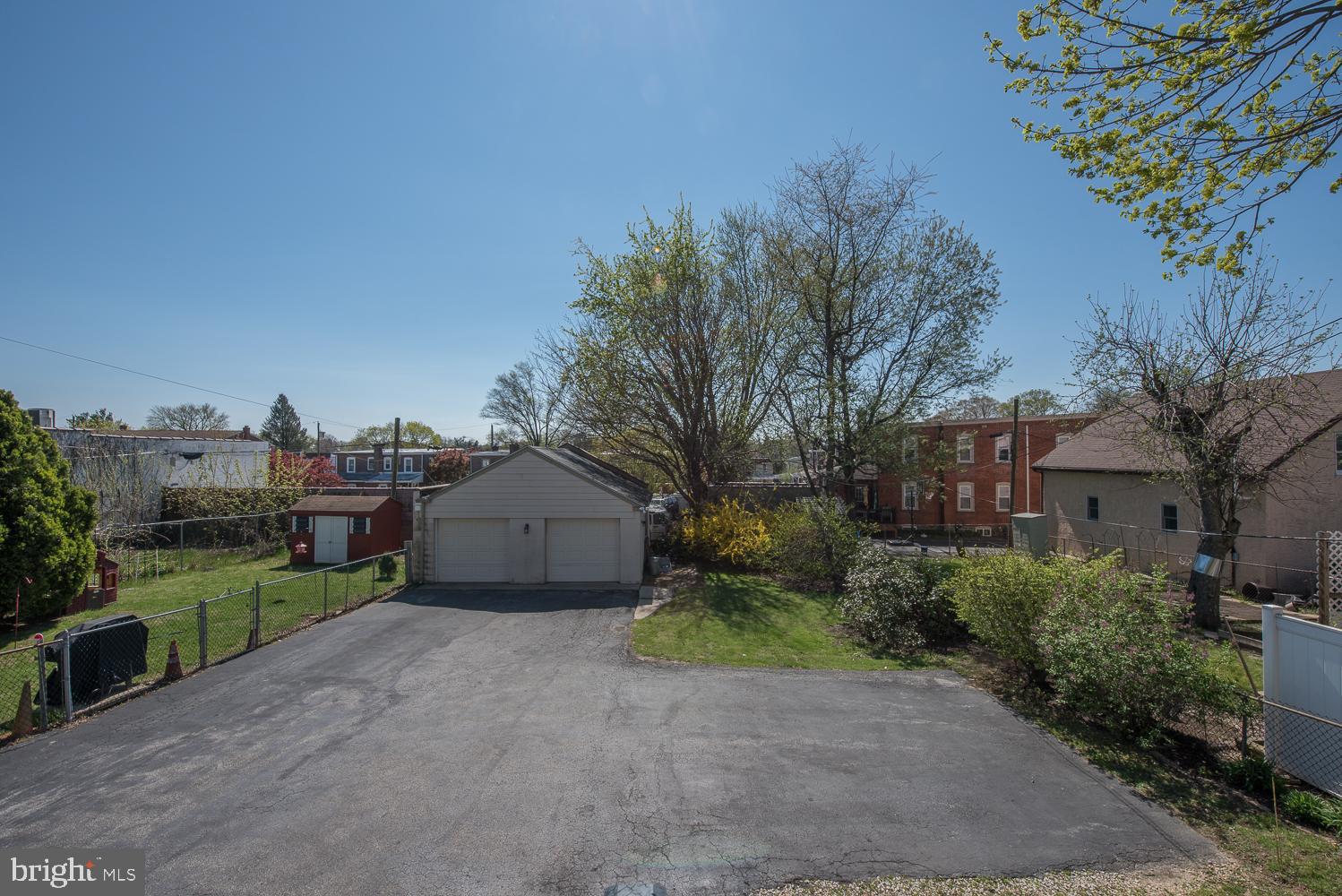 420 Darby Road Havertown, PA 19083 - Photo 19 of 21 a view of a house with a yard and large trees