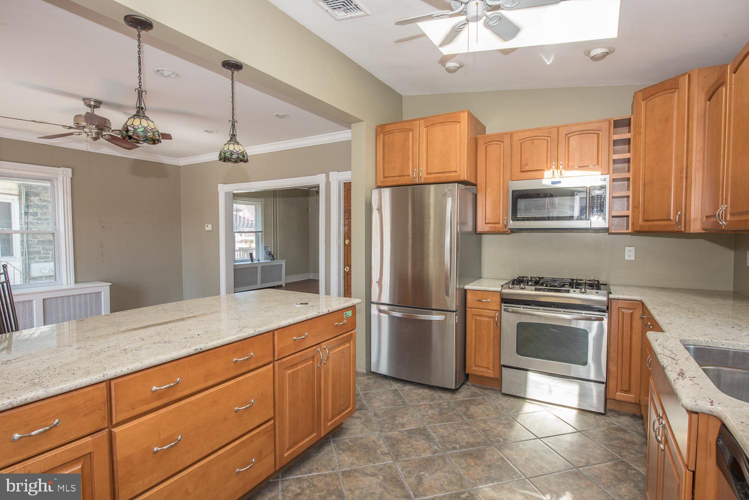 420 Darby Road Havertown, PA 19083 - Photo 7 of 21 a kitchen with stainless steel appliances granite countertop a refrigerator a stove a sink and a refrigerator