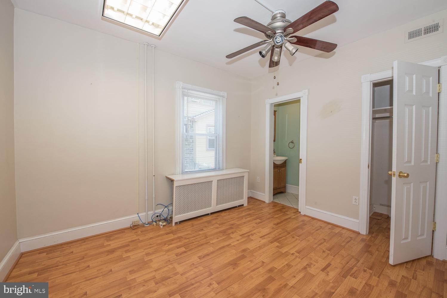 420 Darby Road Havertown, PA 19083 - Photo 8 of 21 wooden floor in an empty room with a window