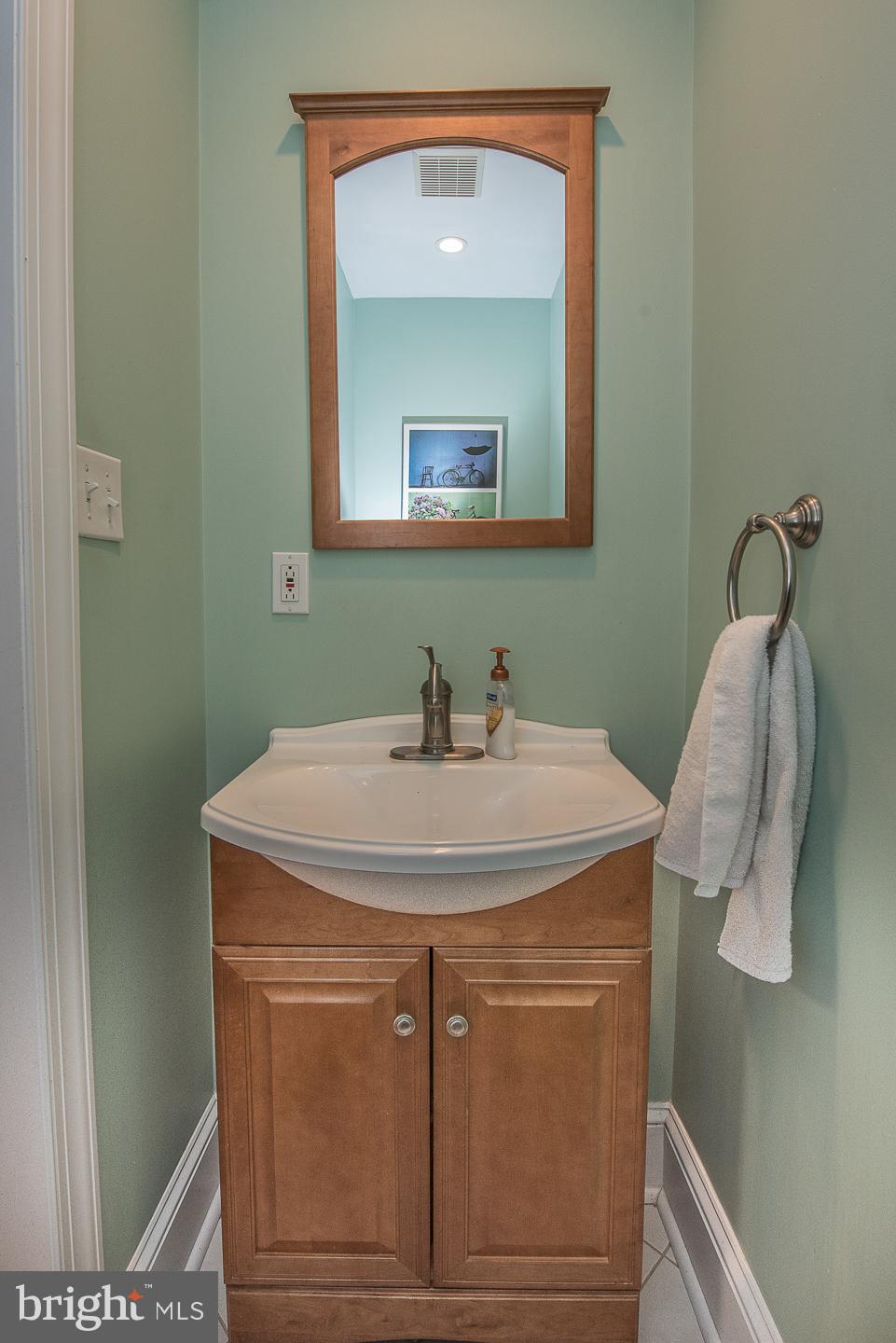 420 Darby Road Havertown, PA 19083 - Photo 9 of 21 a bathroom with a sink and a mirror