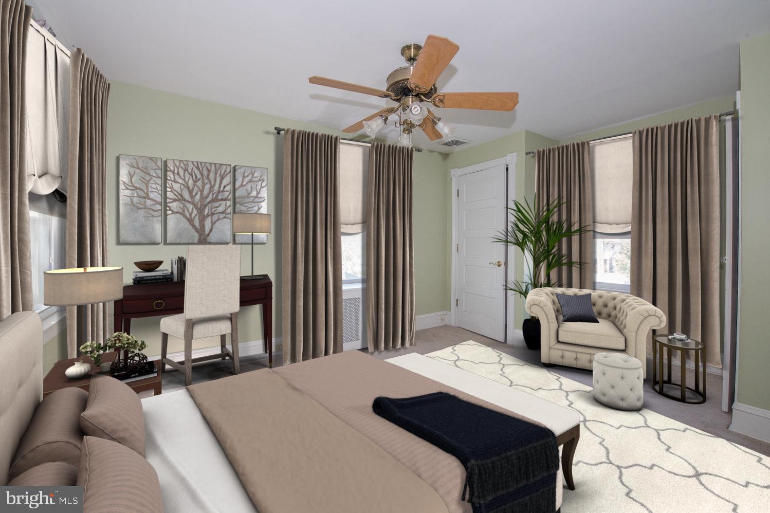 420 Darby Road Havertown, PA 19083 - Photo 10 of 21 a bedroom with a bed and a chandelier