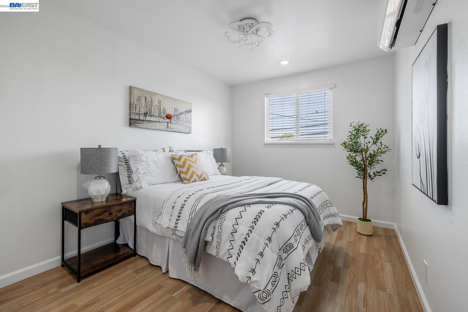 4032 Doane Street Fremont, CA 94538 - Photo 17 of 39 a bedroom with a bed and a potted plant