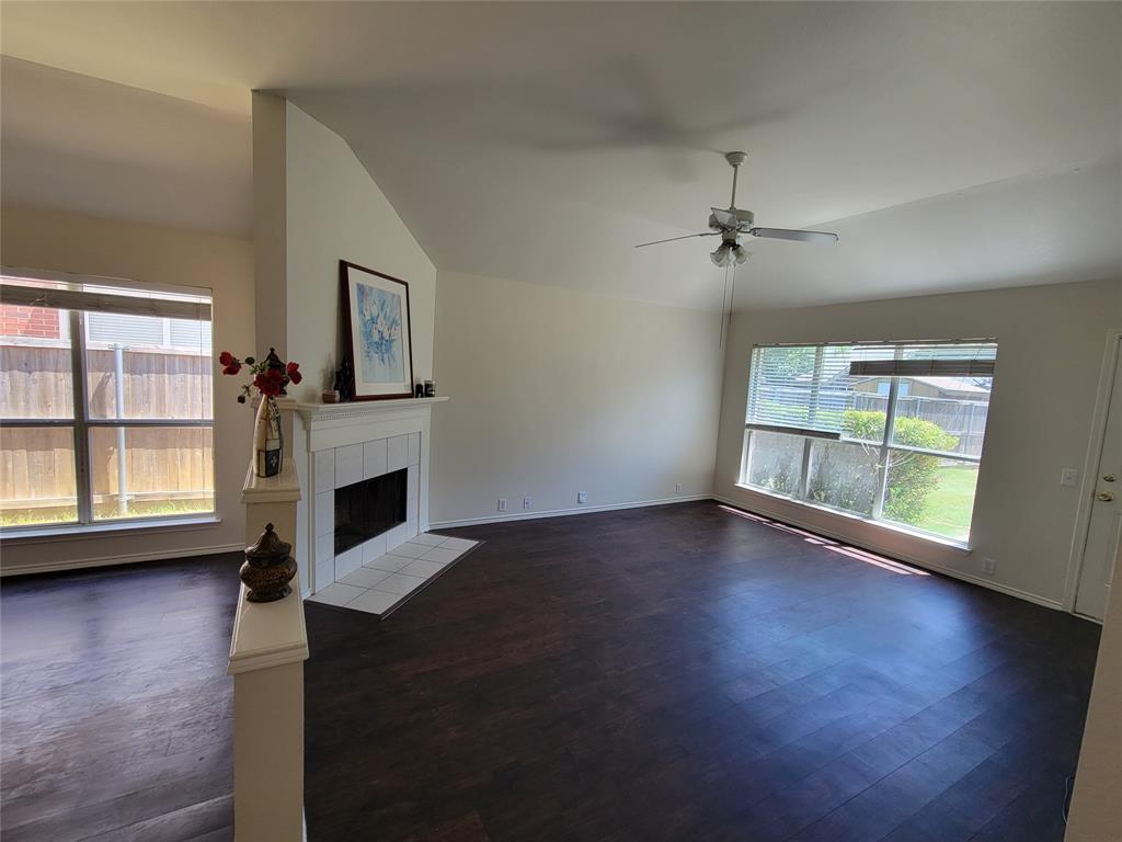 2913 Rush Creek Road McKinney, TX 75072 - Photo 24 of 32 Living room with a fireplace, dark wood-style floors, ceiling fan, and lofted ceiling
