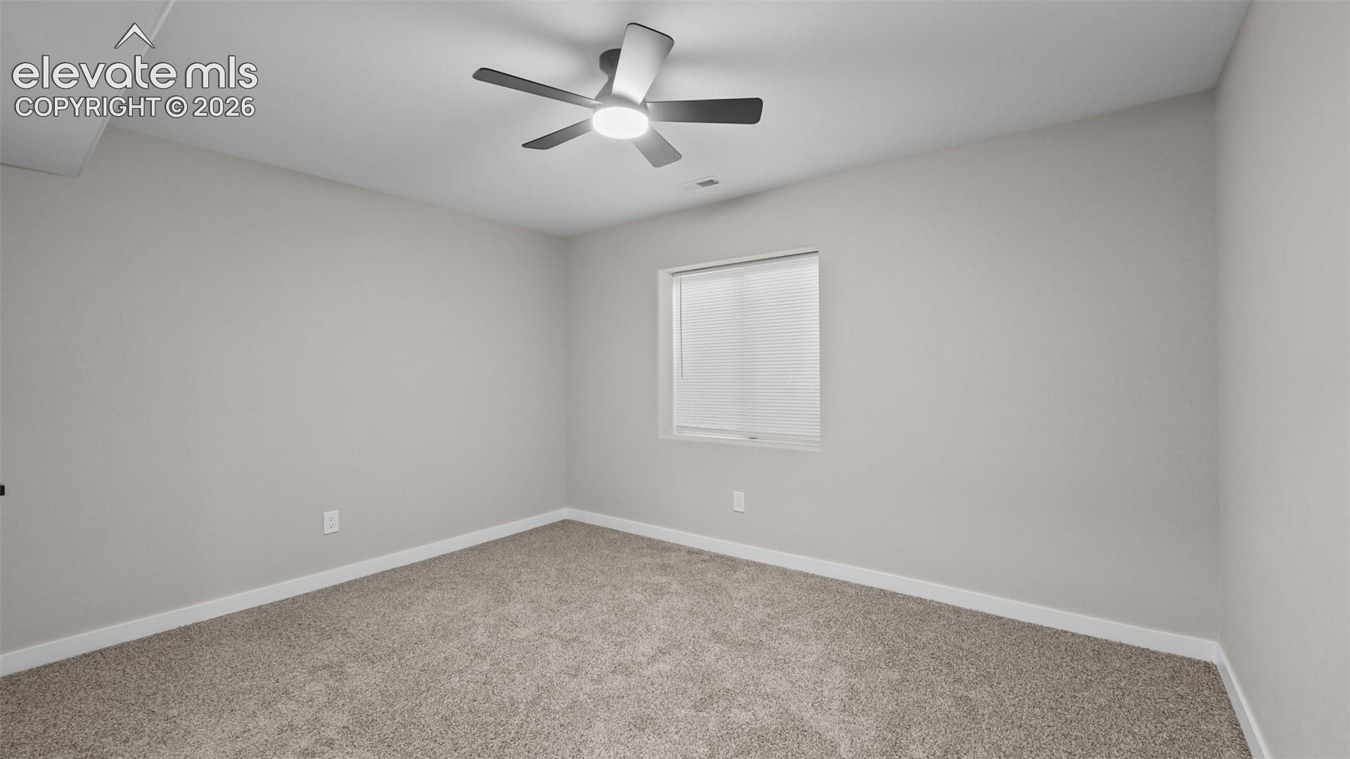 2044 Reed Grass Way Colorado Springs, CO 80915 - Photo 29 of 47 Carpeted flooring, neutral wall finish, recessed window with blinds, and a ceiling fan