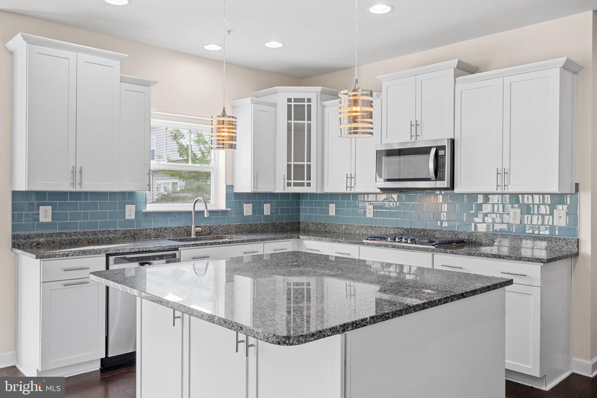 803 Holden Road Frederick, MD 21701 - Photo 13 of 63 a kitchen with stainless steel appliances granite countertop a sink a stove and cabinets
