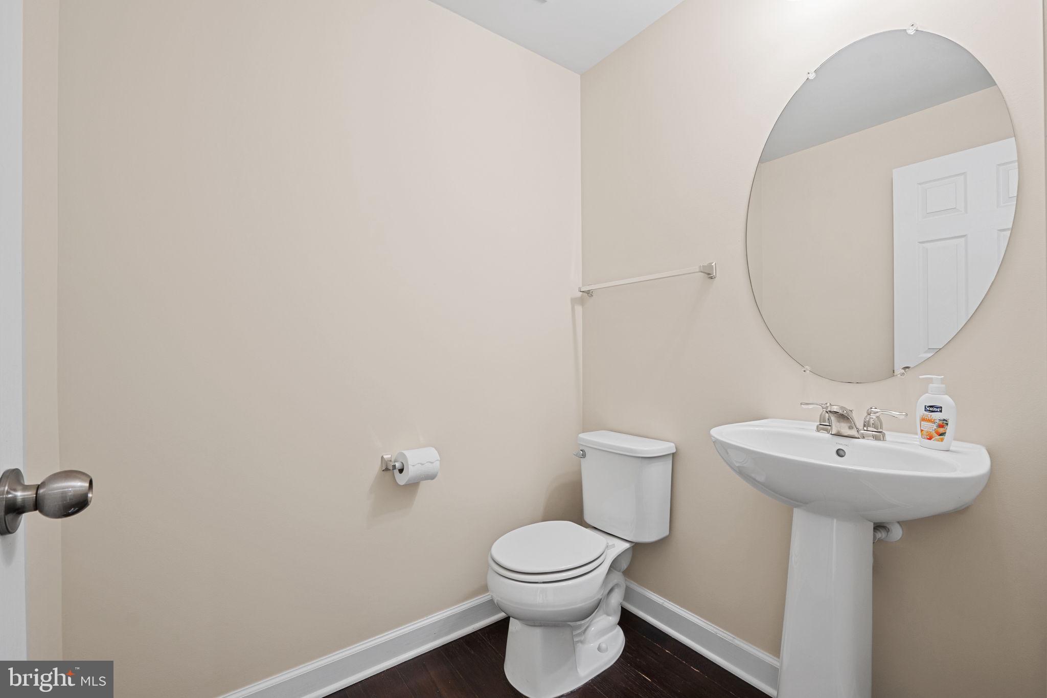 803 Holden Road Frederick, MD 21701 - Photo 20 of 63 a bathroom with a sink toilet and a mirror