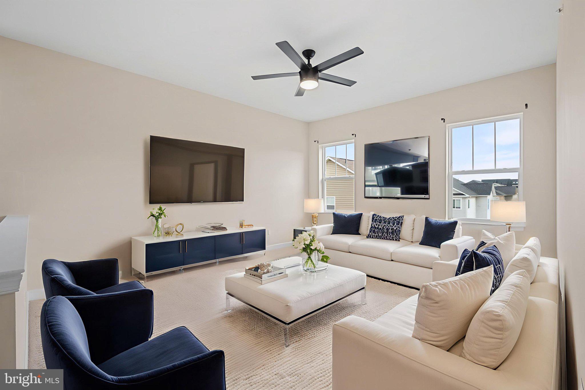 803 Holden Road Frederick, MD 21701 - Photo 23 of 63 a living room with furniture and a flat screen tv