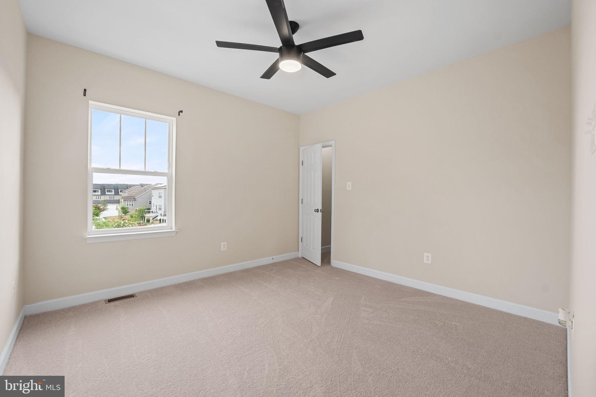 803 Holden Road Frederick, MD 21701 - Photo 36 of 63 a view of an empty room with a window