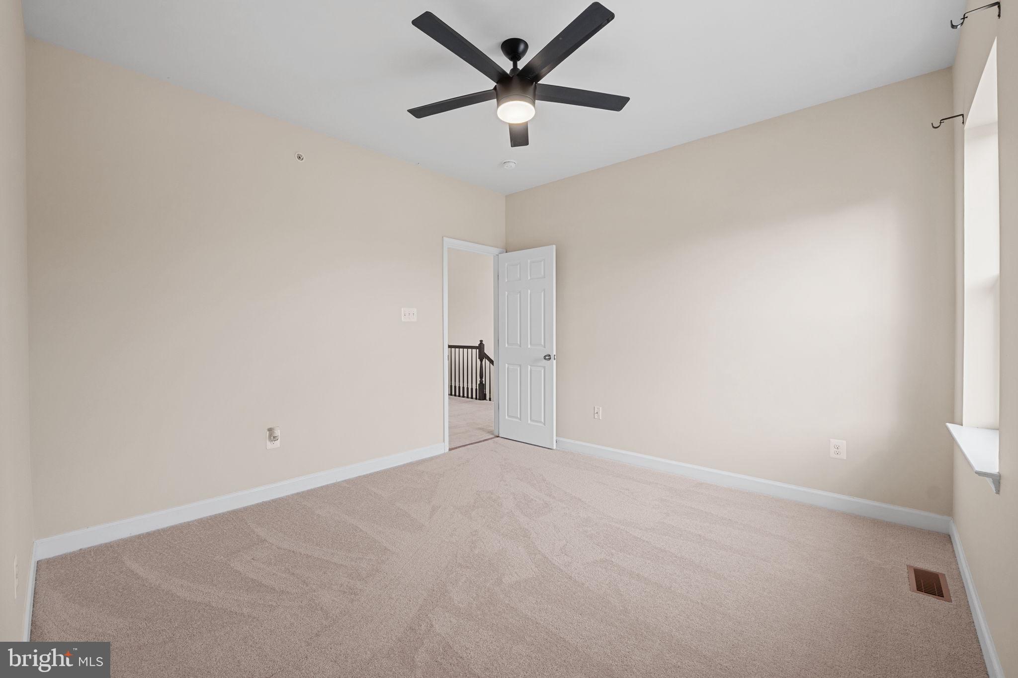 803 Holden Road Frederick, MD 21701 - Photo 38 of 63 an empty room with closet and a ceiling fan