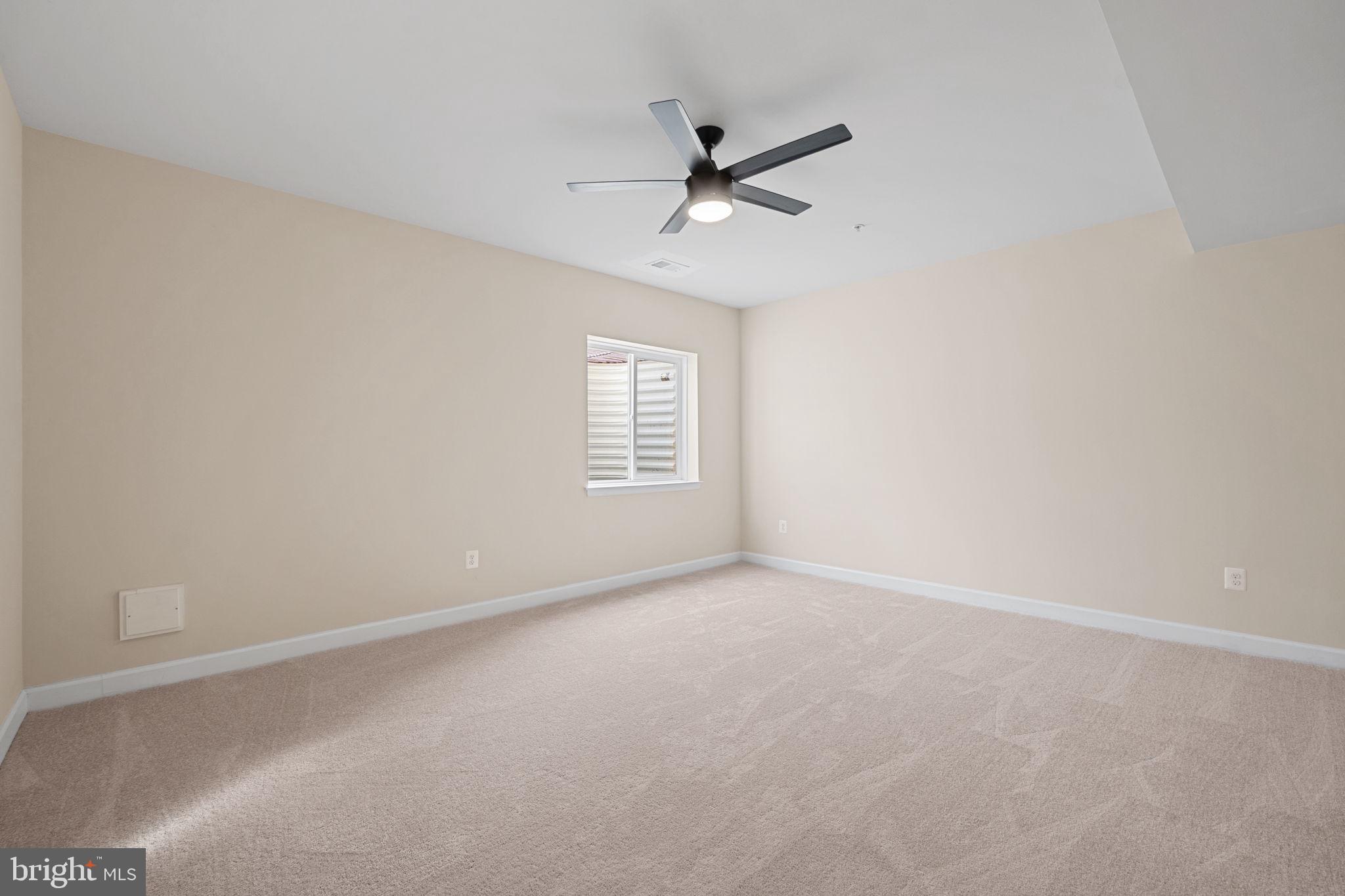 803 Holden Road Frederick, MD 21701 - Photo 48 of 63 an empty room with windows and fan
