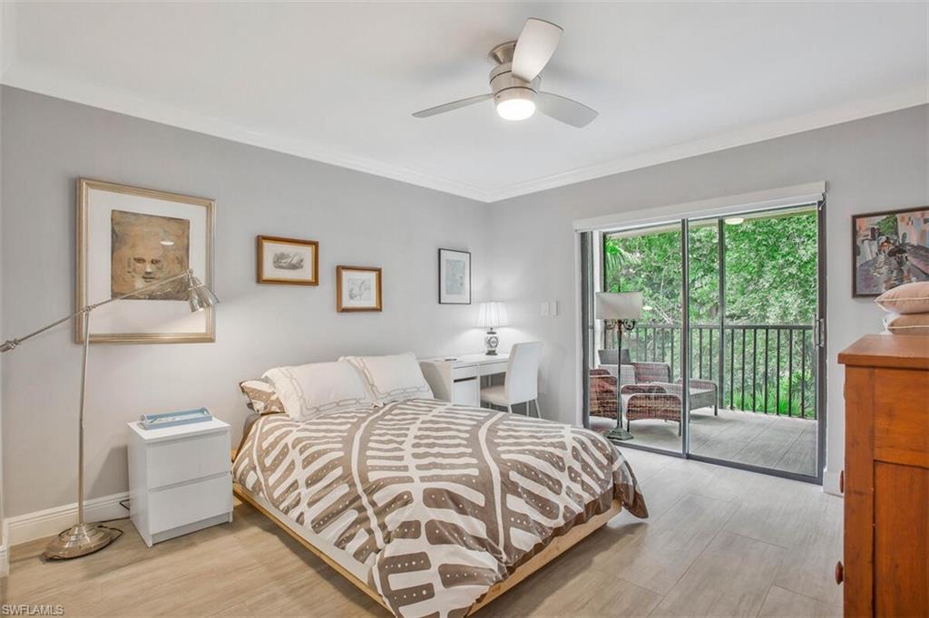 910 Vanderbilt Beach Road, Unit 123W Naples, FL 34108 - Photo 17 of 33 Bedroom featuring ornamental molding, light hardwood / wood-style floors, ceiling fan, and access to outside