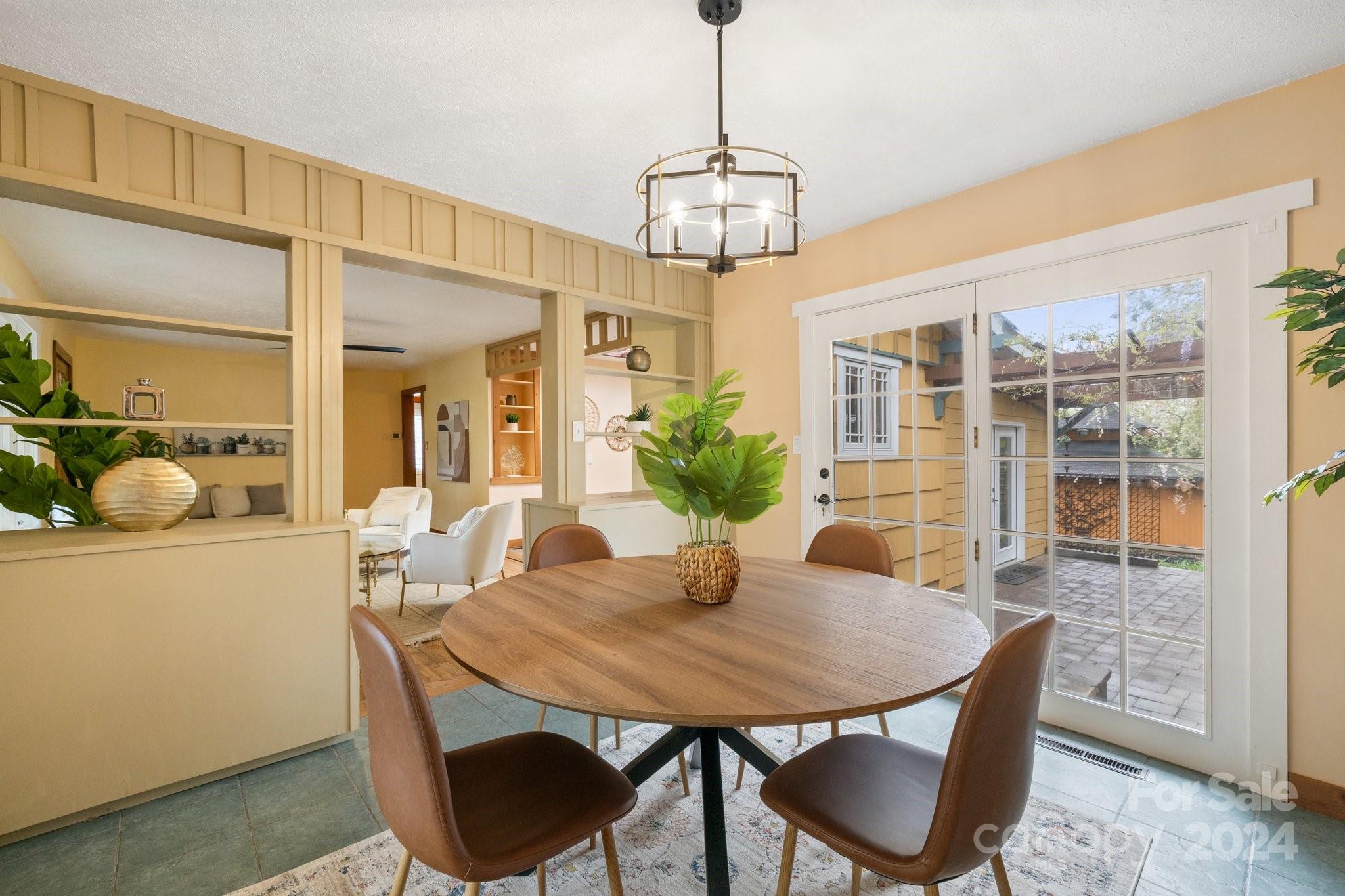 2 Devonshire Place Asheville, NC 28803 - Photo 11 of 47 a view of a dining room with furniture wooden floor and chandelier