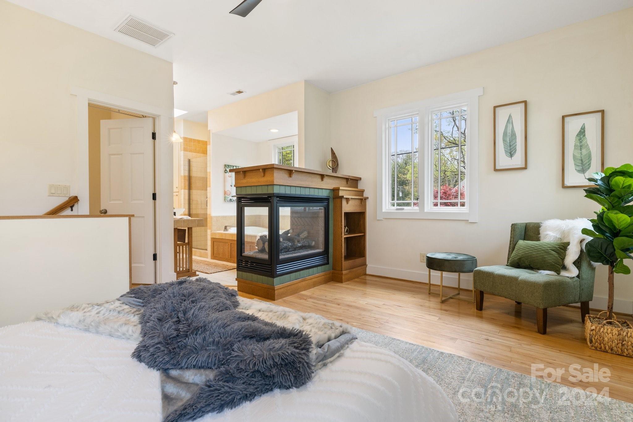 2 Devonshire Place Asheville, NC 28803 - Photo 23 of 47 a spacious bedroom with a bed and a couch