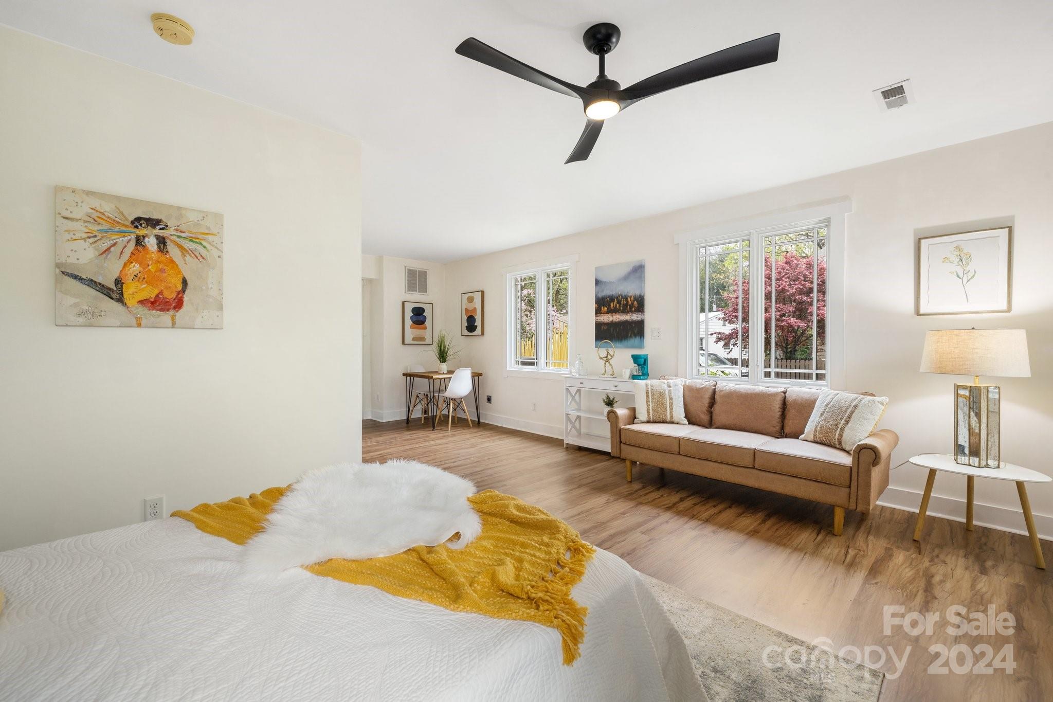 2 Devonshire Place Asheville, NC 28803 - Photo 28 of 47 a living room with furniture and painting on the wall