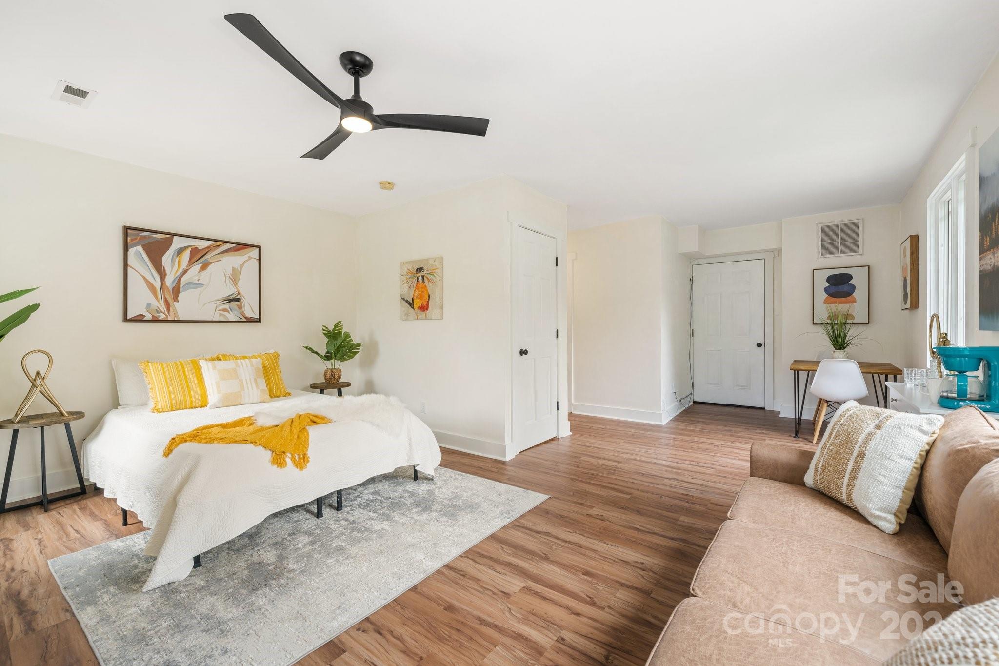 2 Devonshire Place Asheville, NC 28803 - Photo 29 of 47 a bedroom with a bed and ceiling fan