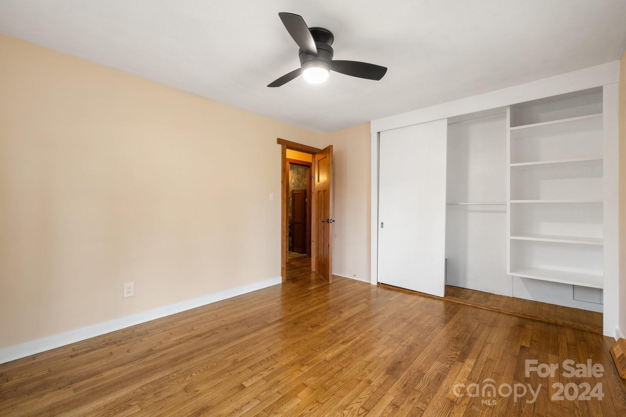 2 Devonshire Place Asheville, NC 28803 - Photo 32 of 47 a view of an empty room with wooden floor and a window