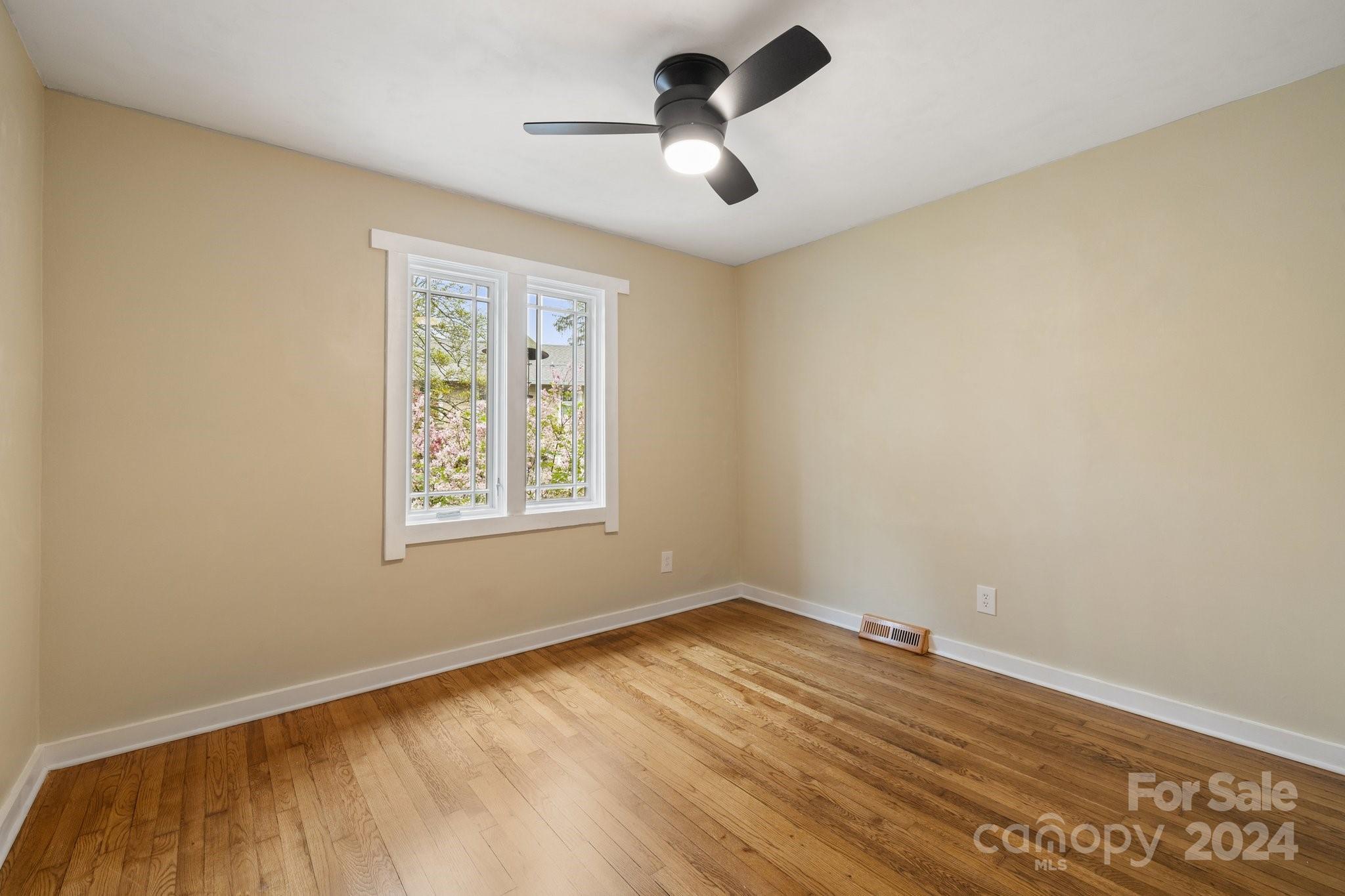2 Devonshire Place Asheville, NC 28803 - Photo 33 of 47 a view of empty room with wooden floor and fan