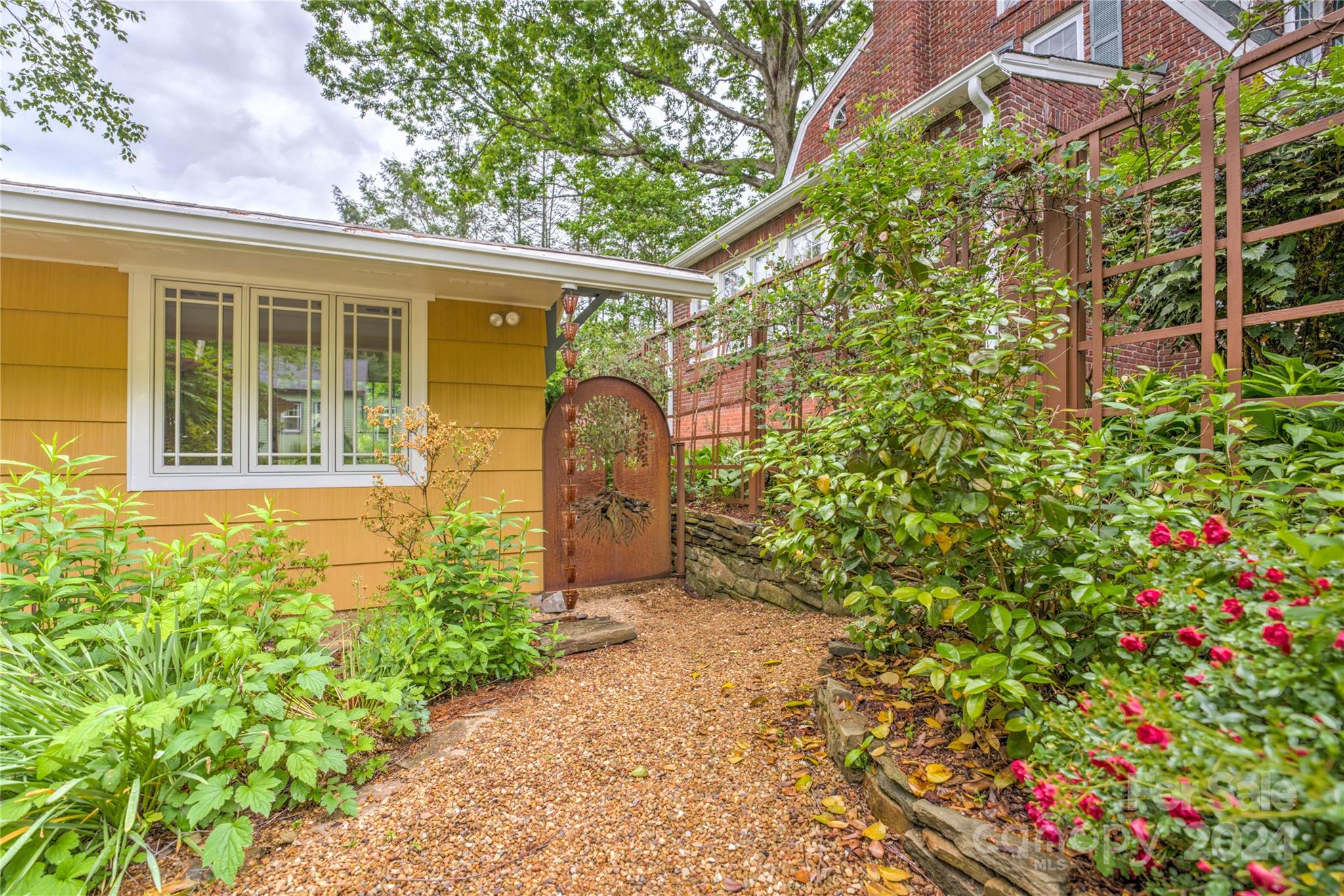 2 Devonshire Place Asheville, NC 28803 - Photo 5 of 47 a front view of a house with a yard and fountain