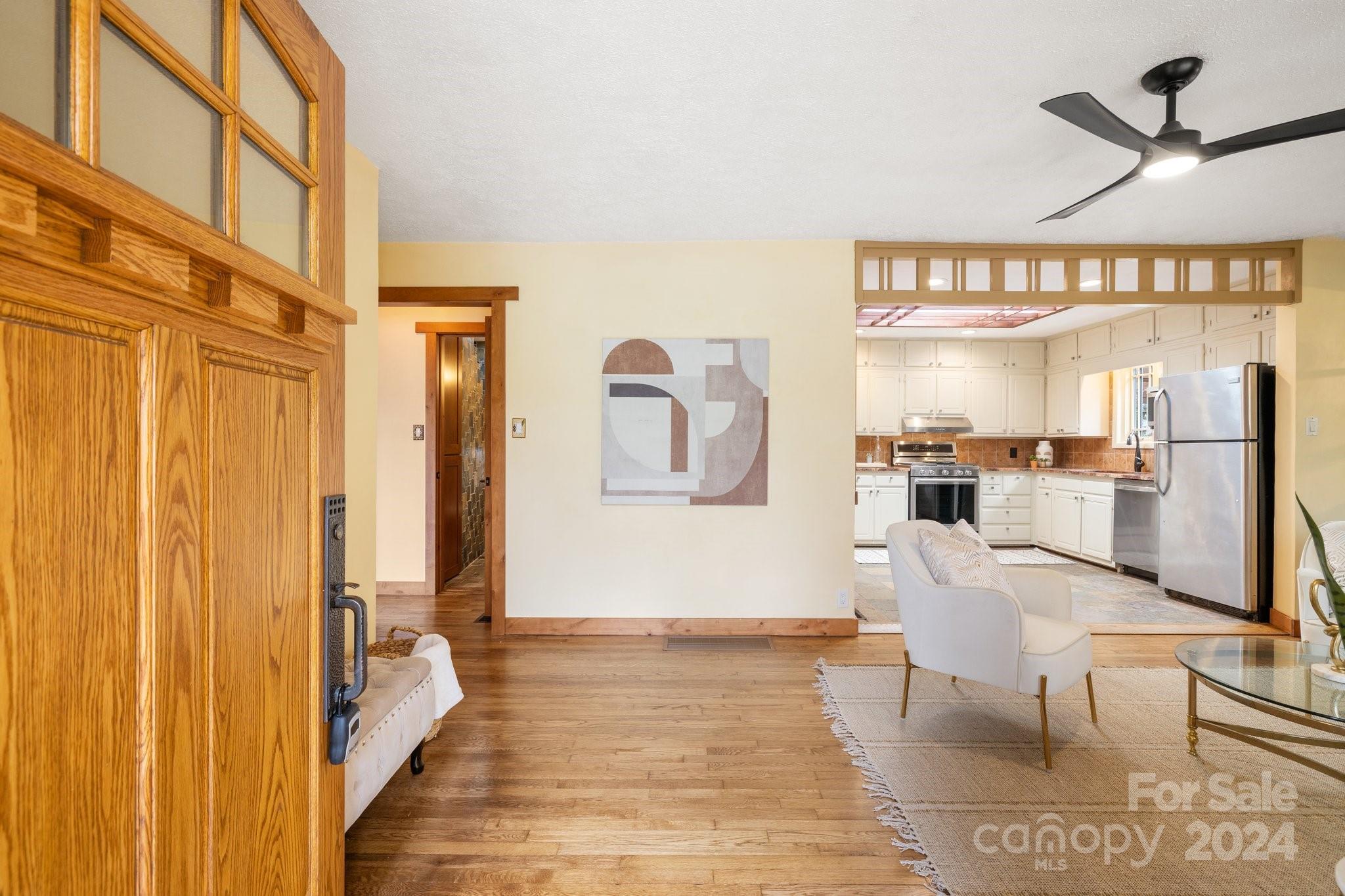 2 Devonshire Place Asheville, NC 28803 - Photo 7 of 47 a living room with furniture a large window and wooden floor