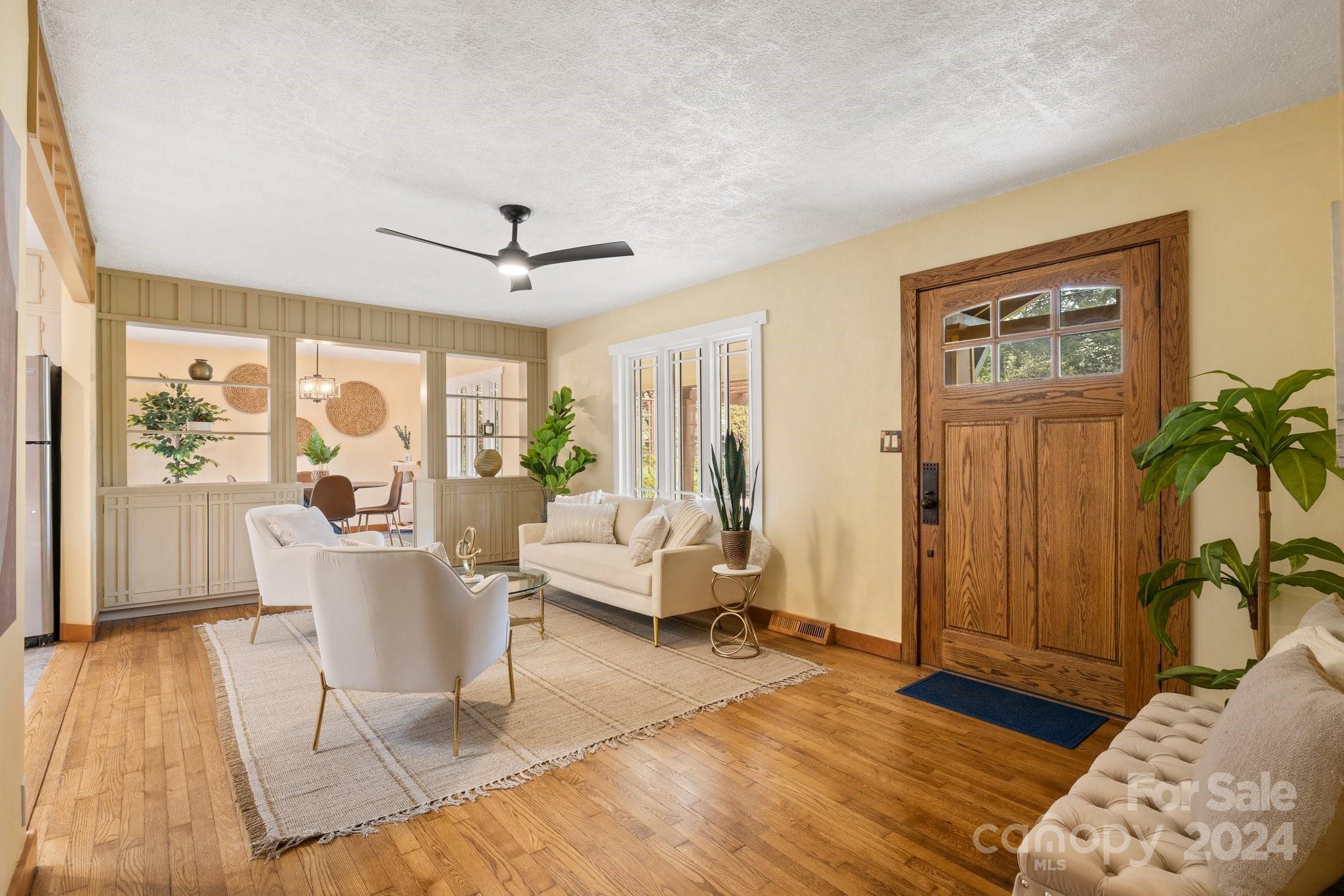 2 Devonshire Place Asheville, NC 28803 - Photo 8 of 47 a living room with furniture and a large window