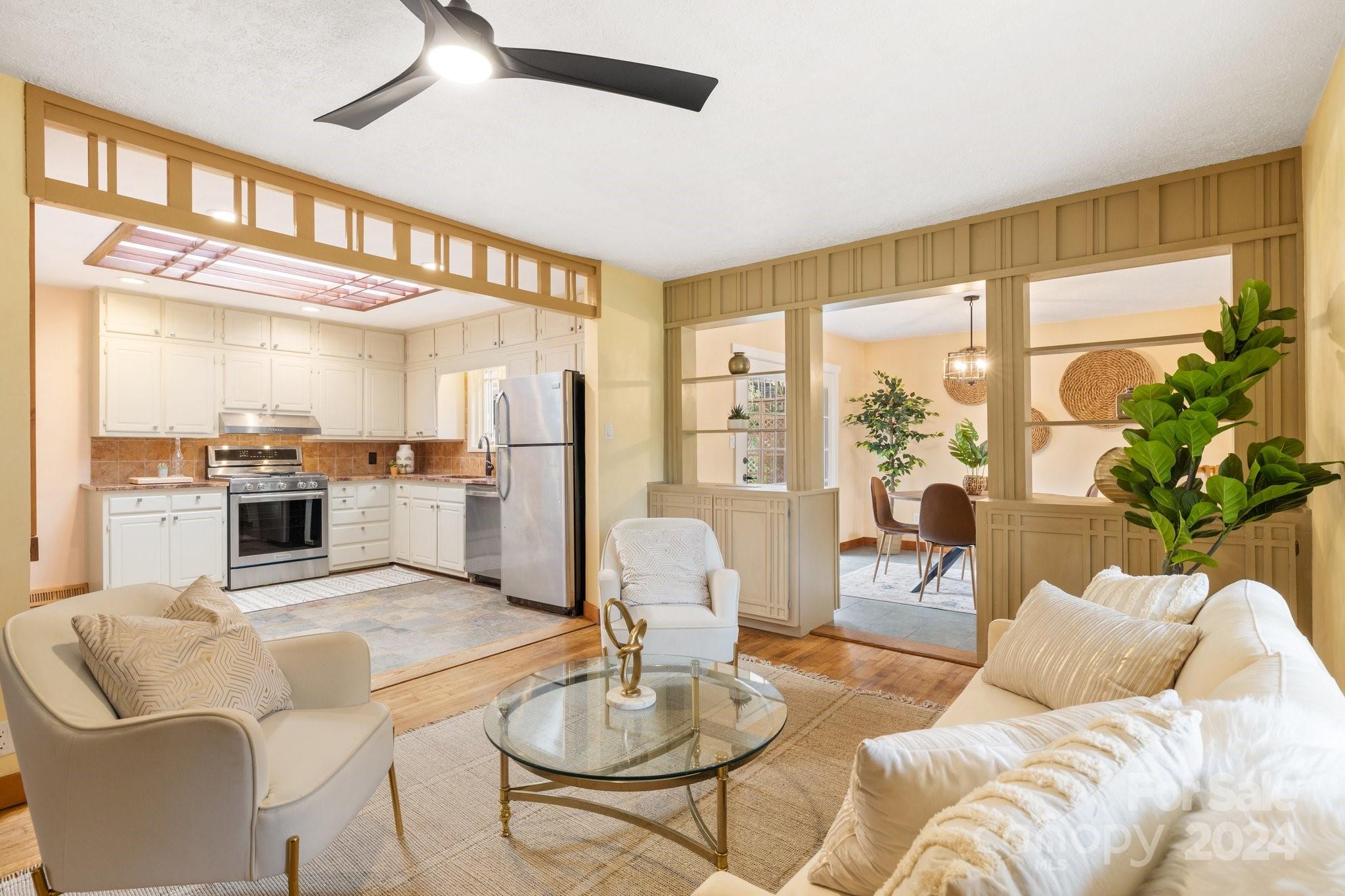 2 Devonshire Place Asheville, NC 28803 - Photo 9 of 47 a living room with furniture kitchen view and a large window