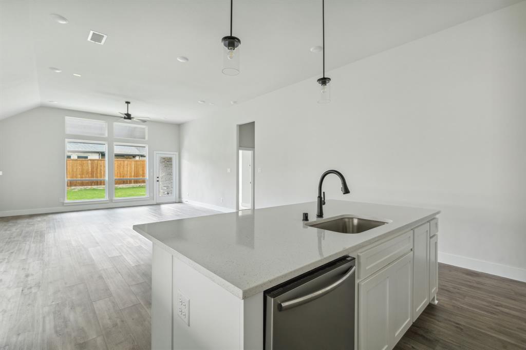 6145 Tahoe Winds Drive Pilot Point, TX 76258 - Photo 6 of 28 a view of a kitchen with a sink and chandelier