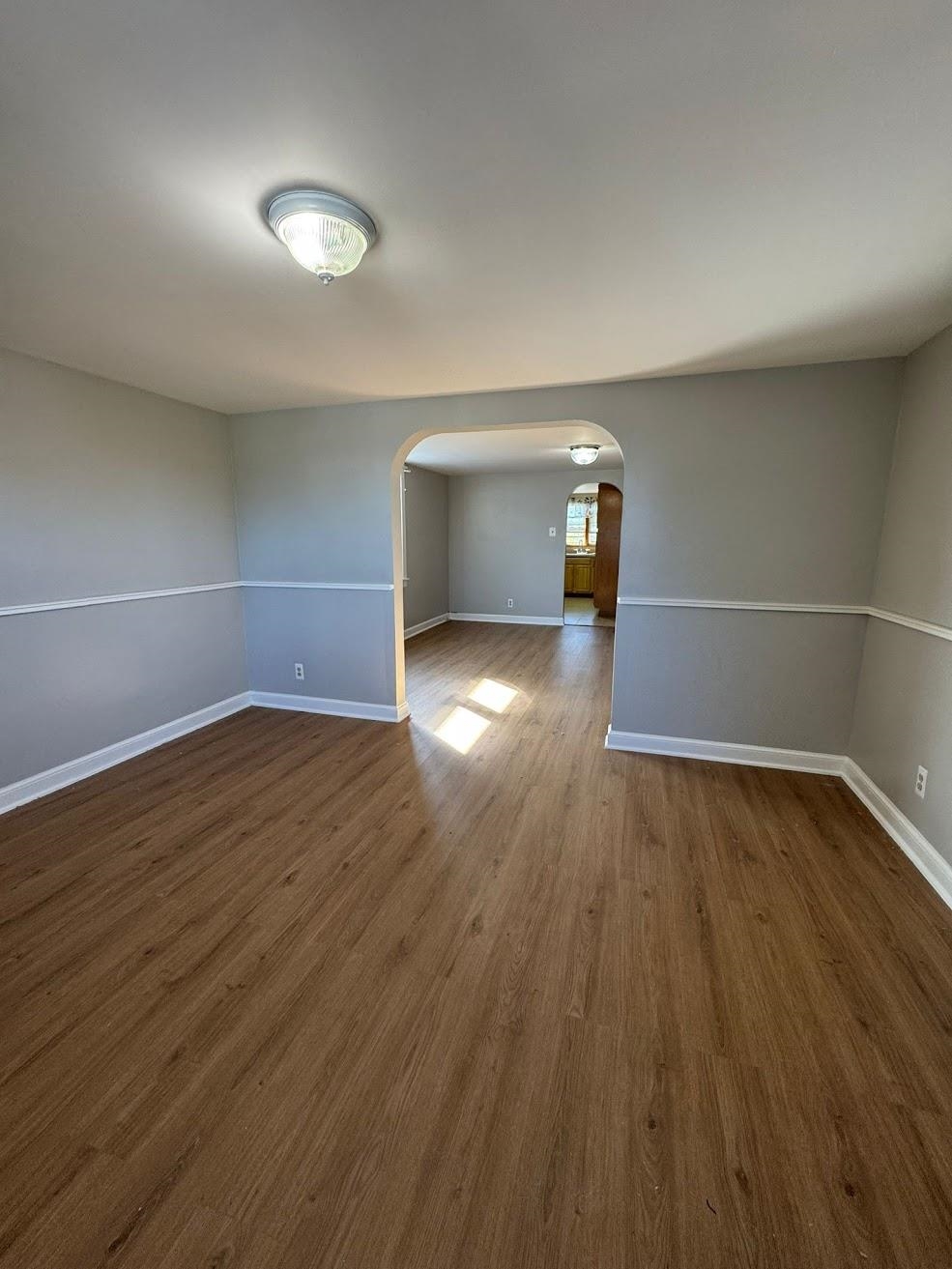 177 Huber Street, Unit 2 Secaucus, NJ 07094 - Photo 6 of 13 an empty room with wooden floor and windows
