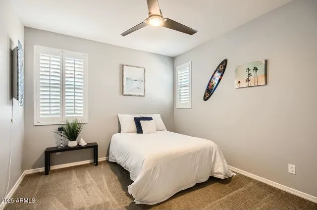 a view of a house with swimming pool and sitting area