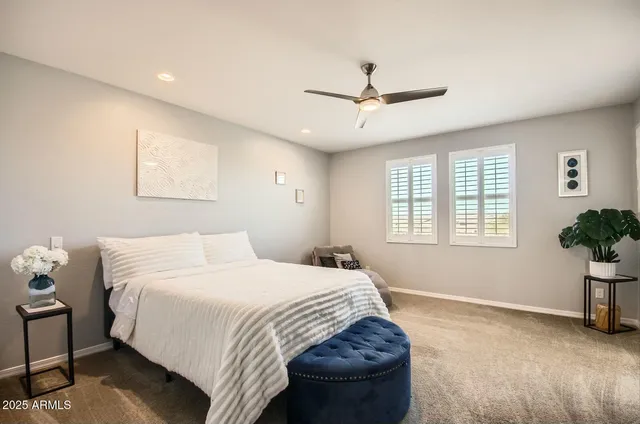 a bedroom with a bed and window