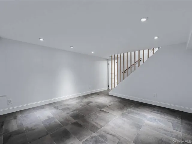 a view of an empty room with stairs