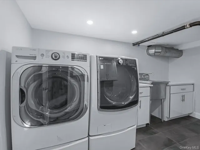 a utility room with dryer and washer