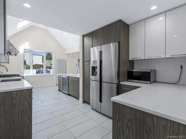 a kitchen with a refrigerator a sink and a stove
