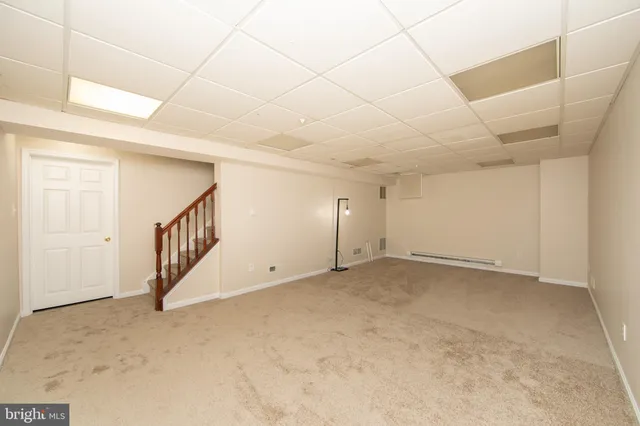 a view of an empty room with stairs