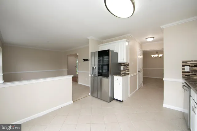 a view of kitchen and cabinets
