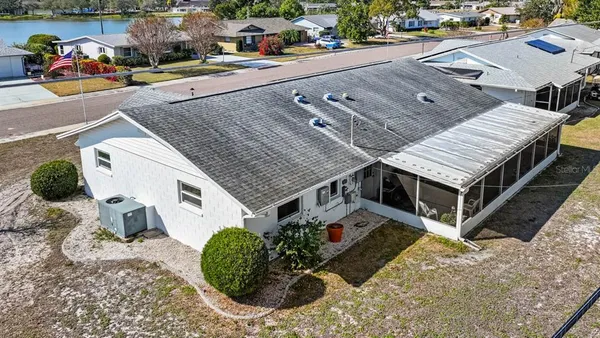 an aerial view of a house with a ocean view