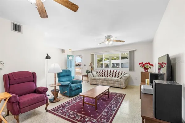 a living room with furniture and a rug