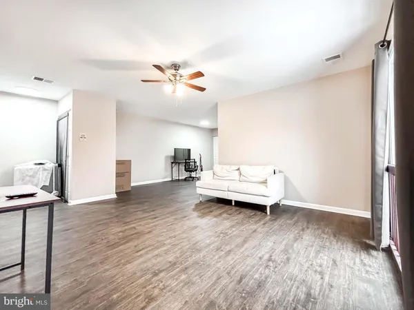 a view of livingroom with furniture and wooden floor