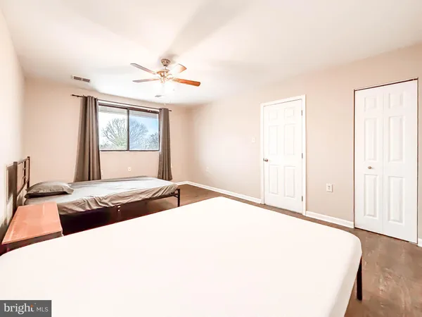 a bedroom with furniture and window