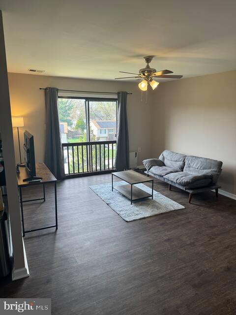 3924 Rolling Rd., Unit B11 Pikesville, MD 21208 - Photo 8 of 17 a living room with furniture a window and a flat screen tv