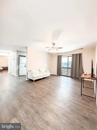 a view of livingroom with furniture and wooden floor