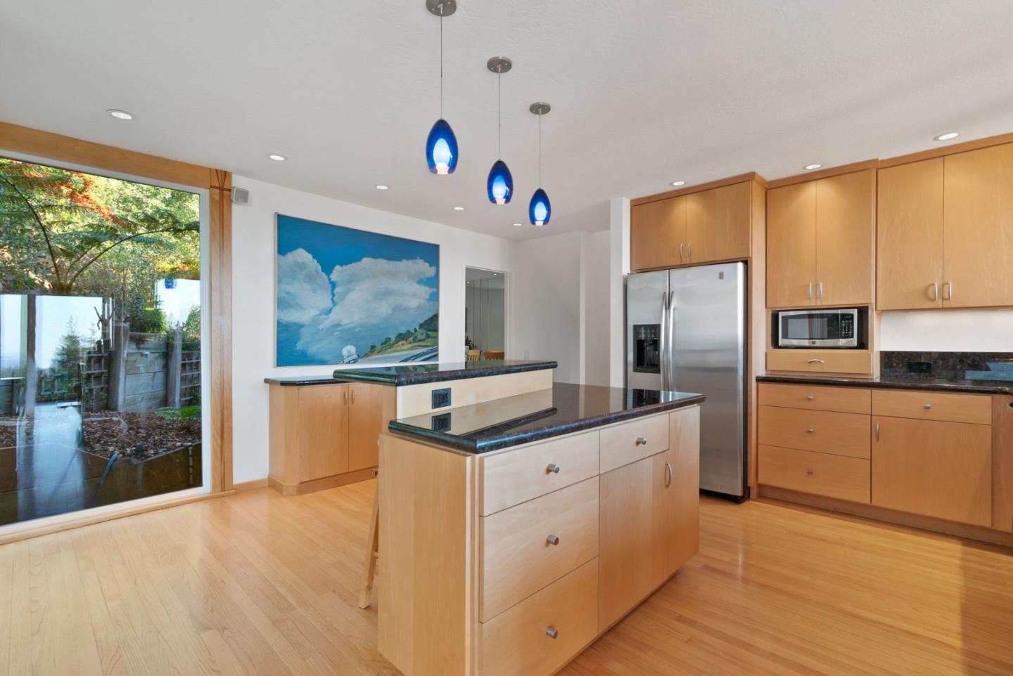 7625 Oak Ridge Road Aptos, CA 95003 - Photo 20 of 67 a kitchen with stainless steel appliances granite countertop a refrigerator a sink dishwasher and wooden cabinets with wooden floor